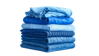 A neatly stacked pile of various shades of folded fabric, isolated on black