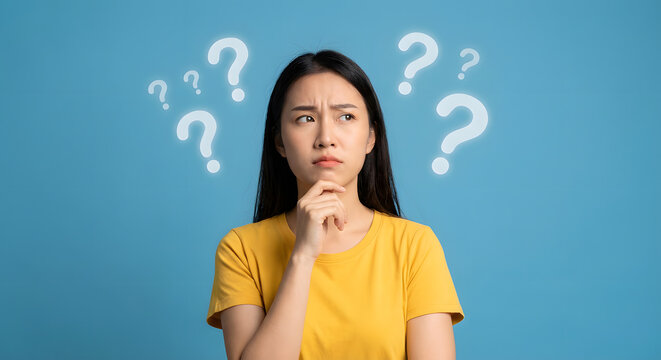 woman thinking with question marks around her - Powered by Adobe