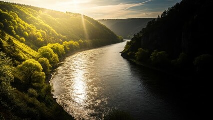 Scenic River Valley Landscape with Lush Green Hills and Sunlight.