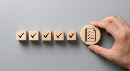 wooden checklist blocks with hand