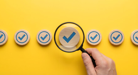 magnifying glass on checklist with blue checkmarks