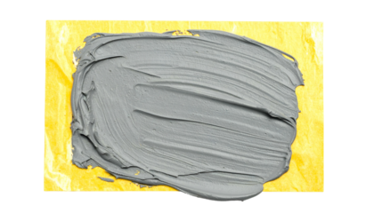 Smear of grey paint on textured yellow surface, contrasting colors and brushstrokes