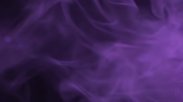 Abstract swirling purple smoke or vapor against a dark background, creating a mystical and ethereal atmosphere.