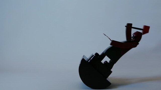 The blacksmith figurine slowly and continuously sways close up, loop