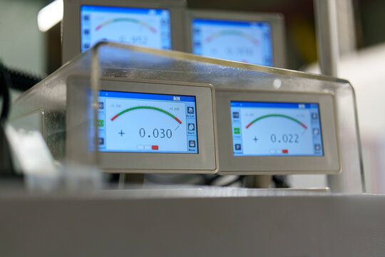 Digital display showing measurement results in a laboratory setting during daytime work hours - Powered by Adobe