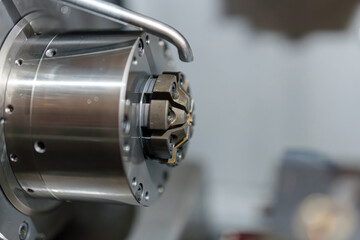 Metal cutting tool set in a machine showing details of the working part during manufacturing process