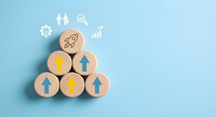 wooden blocks with arrows and business strategy icons