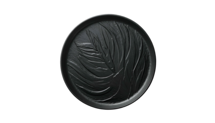 A dark, circular relief sculpture featuring an abstract leaf design, centered