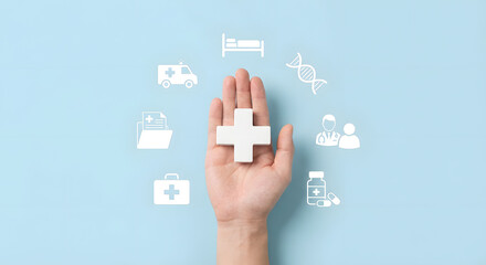 hand holding white cross medical symbol on blue background