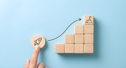 Business growth concept with wooden blocks and finger