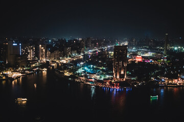 Cairo Skyline Under Night Sky with Bright Reflections on Water