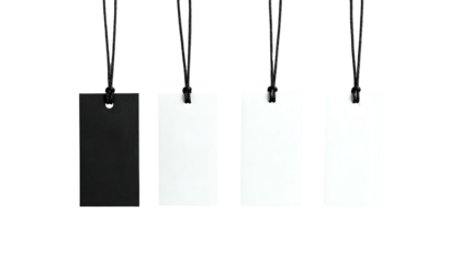 Four rectangular tags hanging, one black and three white, on black cords, against a black background