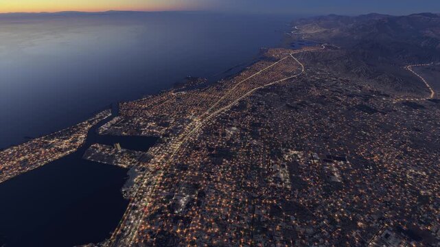 Top aerial drone view at dusk of Ras Al Khaimah in Ras Al Jaima. United Arab Emirates