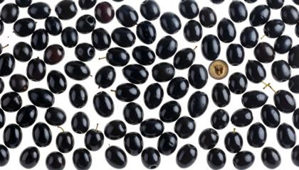 Overhead shot of ripe, glossy black fruit scattered with one cut open to show interior