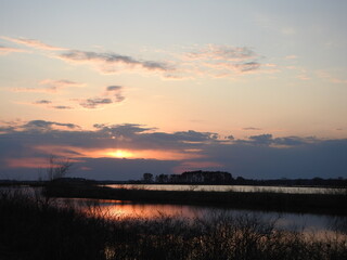 Obraz premium The tranquil beauty of the wetland scenery, during a colorful sunset. Blackwater National Wildlife Refuge, Dorchester County, Cambridge, Maryland.