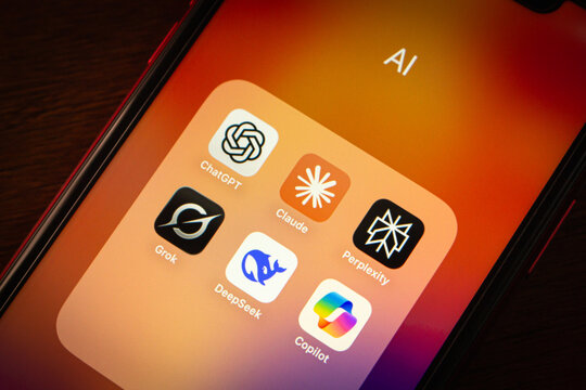 Quito, ECUADOR - Oct 6 2025 : Close-up of a smartphone folder showing popular AI chatbot apps including ChatGPT, Claude, Grok, Copilot, Perplexity, and DeepSeek.