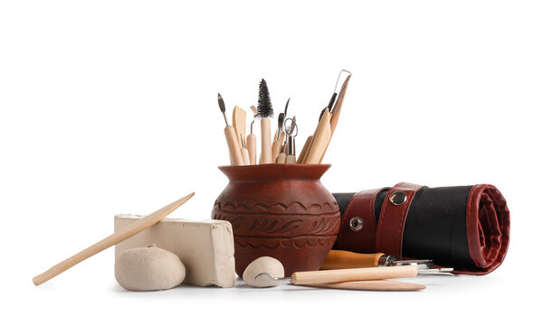 Ceramic pottery, clay, organizer pouch and set of sculptor tools isolated on white background