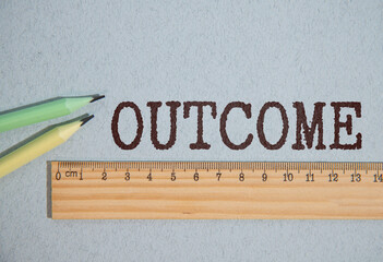 torn white paper on blue background. Text of OUTCOMES