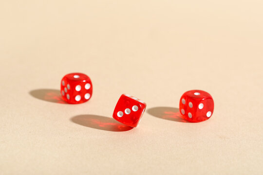 Red game dices on beige background
