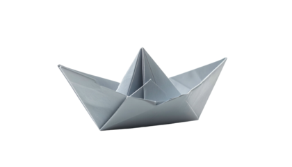 A paper boat, crafted from gray paper, sits centered on a stark black background