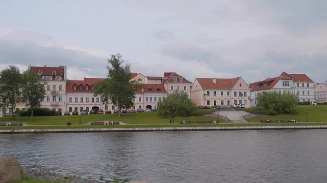 Picturesque view of the trinity suburb historical district, an old town quarter on the bank of the svislach river in minsk, belarus, with its charming architecture and riverside park