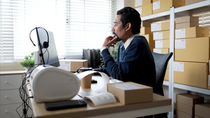 Warehouse manager analyzing data on desktop computer, planning inventory and business operations in storage office - Powered by Adobe