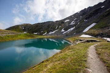 Hiking trail next to Summit Lake at the top of Hatcher Pass in the Talkeetna mountains near Wasilla Alaska United States