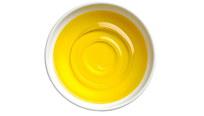 Overhead view of a white bowl filled with golden-yellow liquid, creating concentric circles