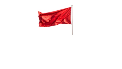 Isolated, vibrant red flag waving on a pole against a stark, black background