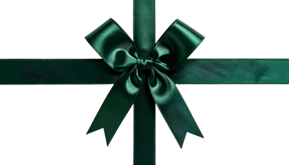 A lush, emerald-green satin bow and ribbon cross against a solid black background