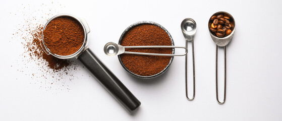 Composition with coffee powder and beans on white background © Pixel-Shot