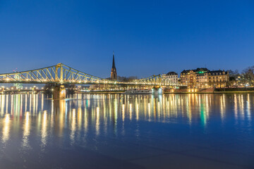 old iron Footbridge called eiserner Steg in Frankfurt spanning river Main by night in Frankfurt