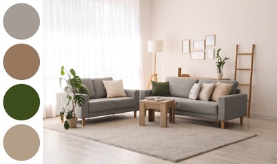 Interior of light living room with grey sofas, ladder and lamp. Different color patterns