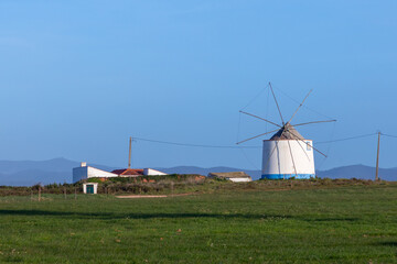 old historic windmill at the field in Rogil, district Faro