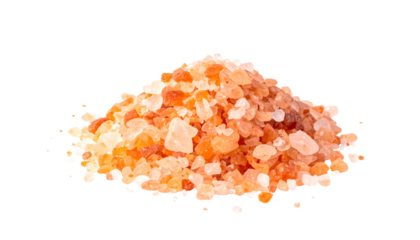 A small pile of pinkish-orange coarse crystals with an isolated dark background