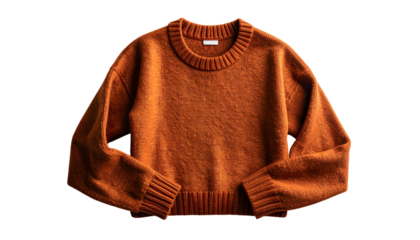 Close-up of a cozy, burnt-orange sweater on a solid black background