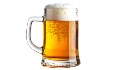 A frothy, golden mug of beer with a generous head, isolated on black
