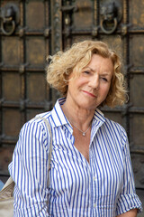 attractive mature woman with curly blonde hair