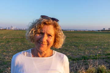 portrait of attractive smiling mature woman, looking friendly and happy
