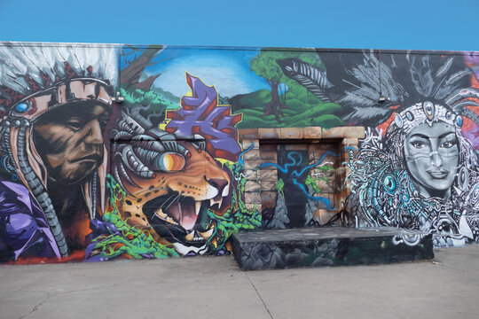 colorful mural at an old brick wall