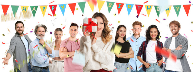 Obraz premium Birthday girl holding gift box among her family and friends on white background. Surprise party