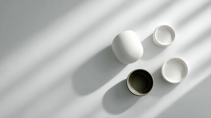 A minimalist white background with gentle shadows from unseen objects, providing a clean and versatile space