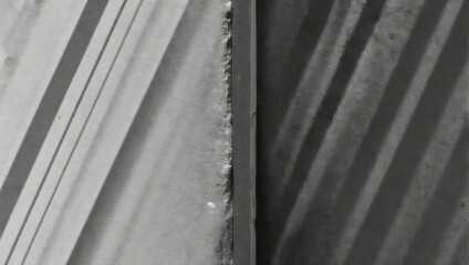 Divided abstract photo with diagonal lines and shadows, creating a geometric composition