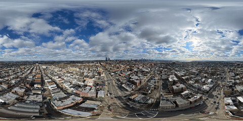 Drone photo capturing expansive cloud formations over Jersey City with textured skies, soft daylight, and layered cloud patterns creating a clean natural background suitable for weather and atmosphere
