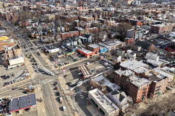 Aerial drone views looking straight down over Jersey City streets reveal dense urban patterns, intersecting roads, rooftops, and city blocks, showcasing the scale, layout, and everyday rhythm of a mod