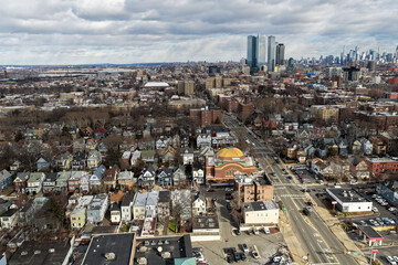 Aerial drone views looking straight down over Jersey City streets reveal dense urban patterns, intersecting roads, rooftops, and city blocks, showcasing the scale, layout, and everyday rhythm of a mod