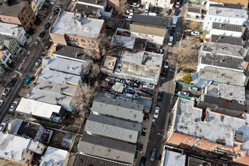 Aerial drone views looking straight down over Jersey City streets reveal dense urban patterns, intersecting roads, rooftops, and city blocks, showcasing the scale, layout, and everyday rhythm of a mod