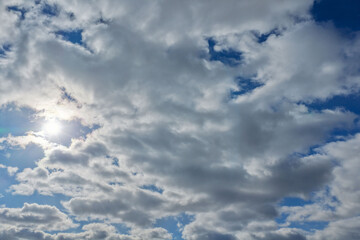 Aerial drone photo from Jersey City featuring Manhattan skyline views, dense city blocks, waterfront buildings, and modern New York City architecture under dynamic daytime cloud cover.                