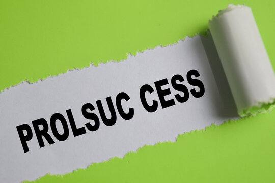 Prolsuc cess text written in torn paper