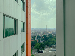 a view of a busy city from the window of a building
